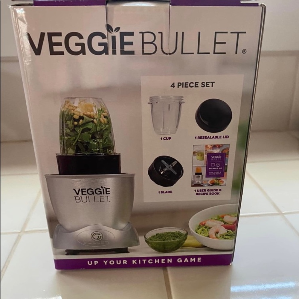 Never used. Veggie bullet 4 piece set